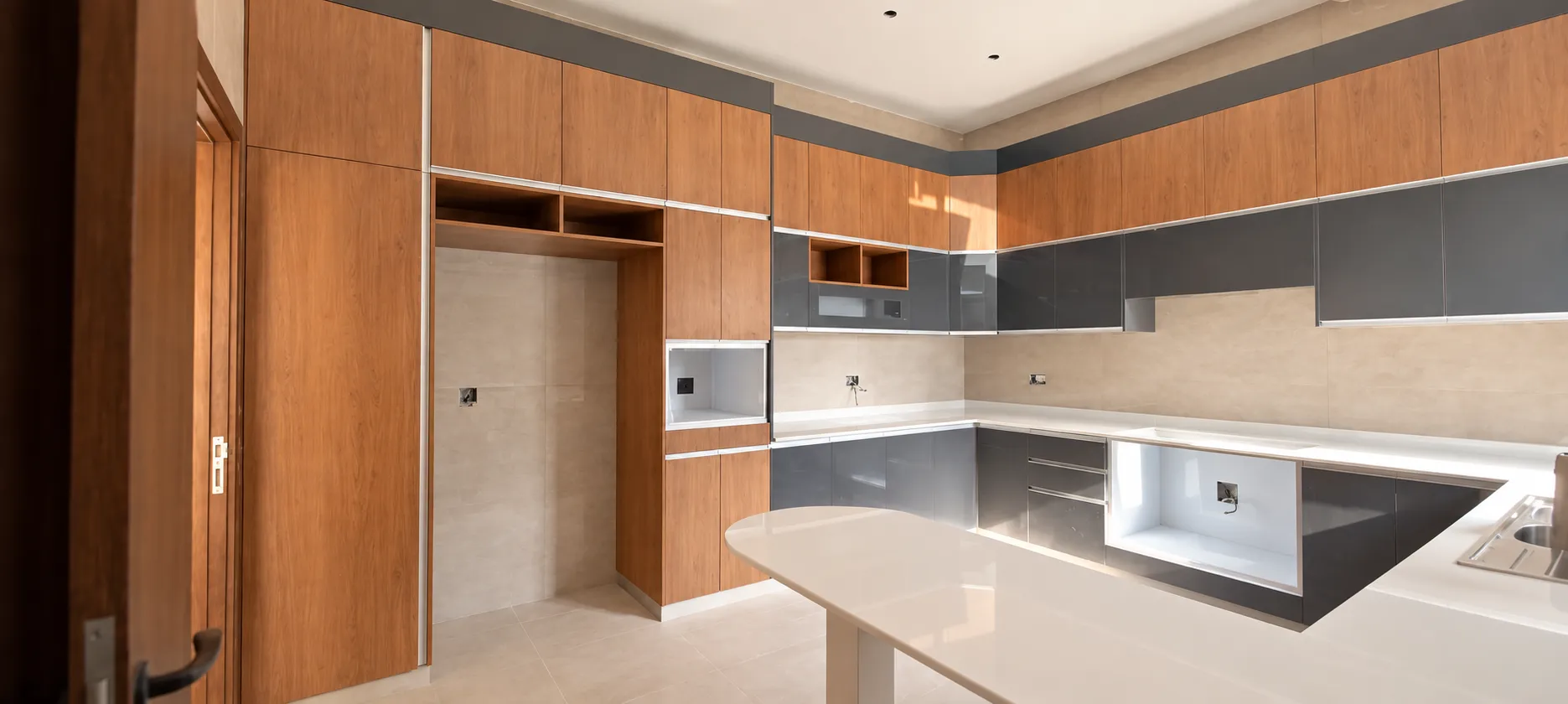 Wide kitchen with walnut and gloss-charcoal finishes