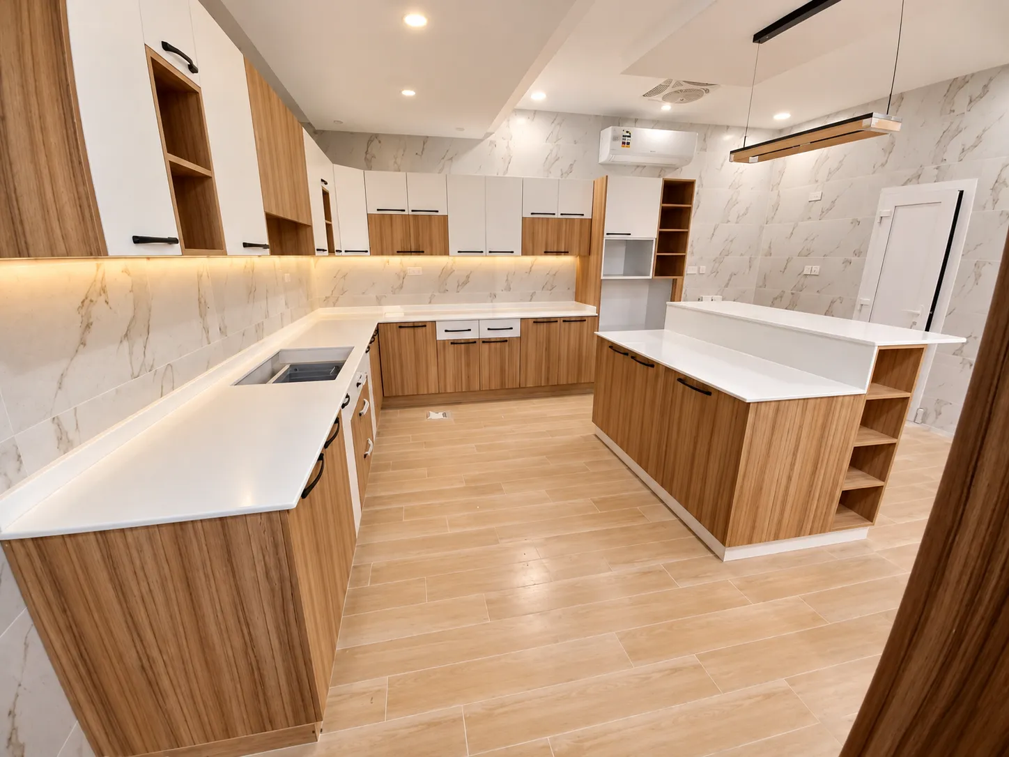Walnut and warm-white kitchen island with a marble-effect worktop